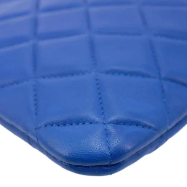 CHANEL O Case Large Quilted Lambskin Leather Clutch Blue