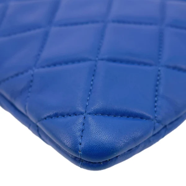 CHANEL O Case Large Quilted Lambskin Leather Clutch Blue