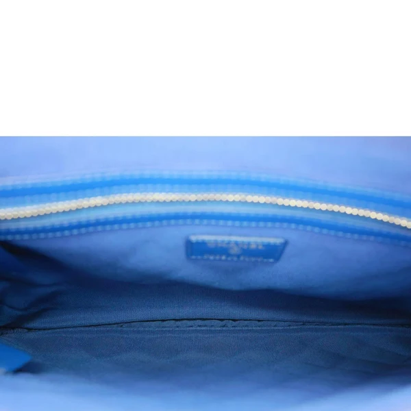 CHANEL O Case Large Quilted Lambskin Leather Clutch Blue
