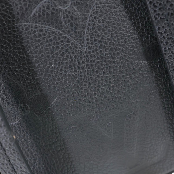 LOUIS VUITTON Tiny Monogram Empreinte Leather Backpack Black