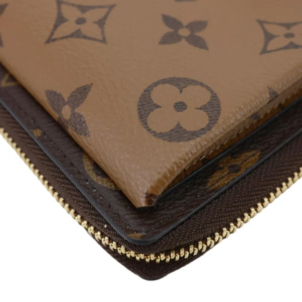LOUIS VUITTON Metis Reverse Monogram Canvas Vertical Zippy Chain Wallet Brown
