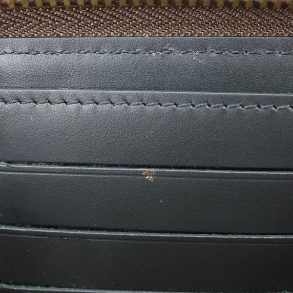 LOUIS VUITTON Metis Reverse Monogram Canvas Vertical Zippy Chain Wallet Brown