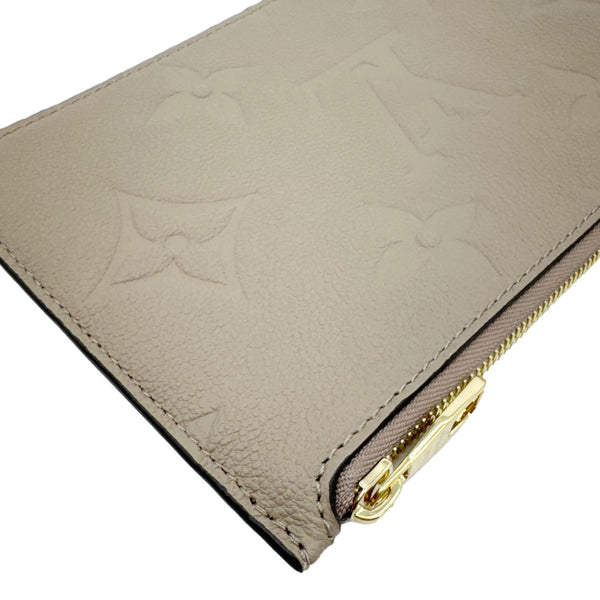 LOUIS VUITTON Empreinte Leather Wristlet Beige